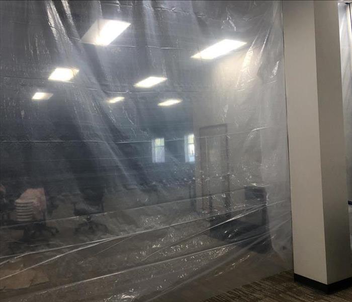 Plastic containment set up in a call center room 